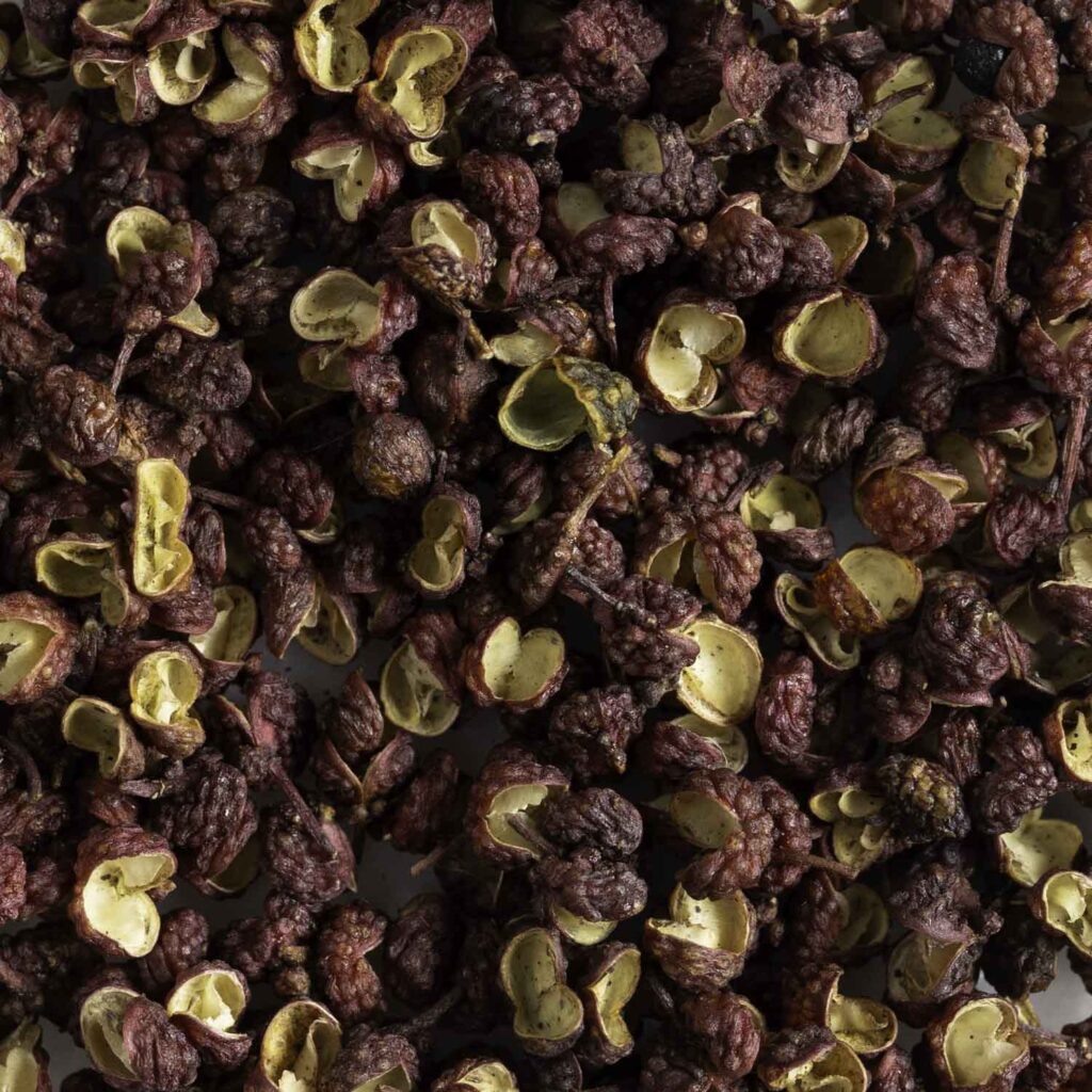 Macro view of red Sichuan pepper.