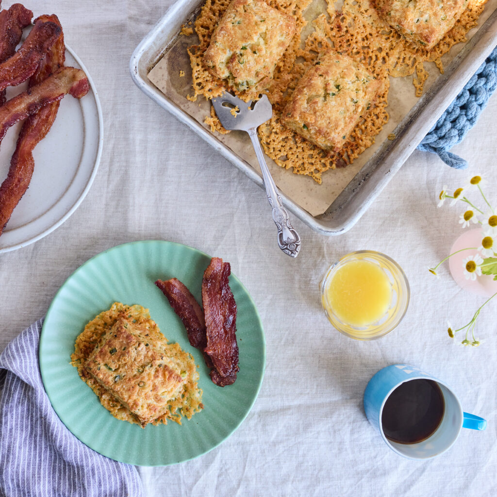 Megan's cheddar-scallion biscuits, served with bacon, orange juice, and coffee.